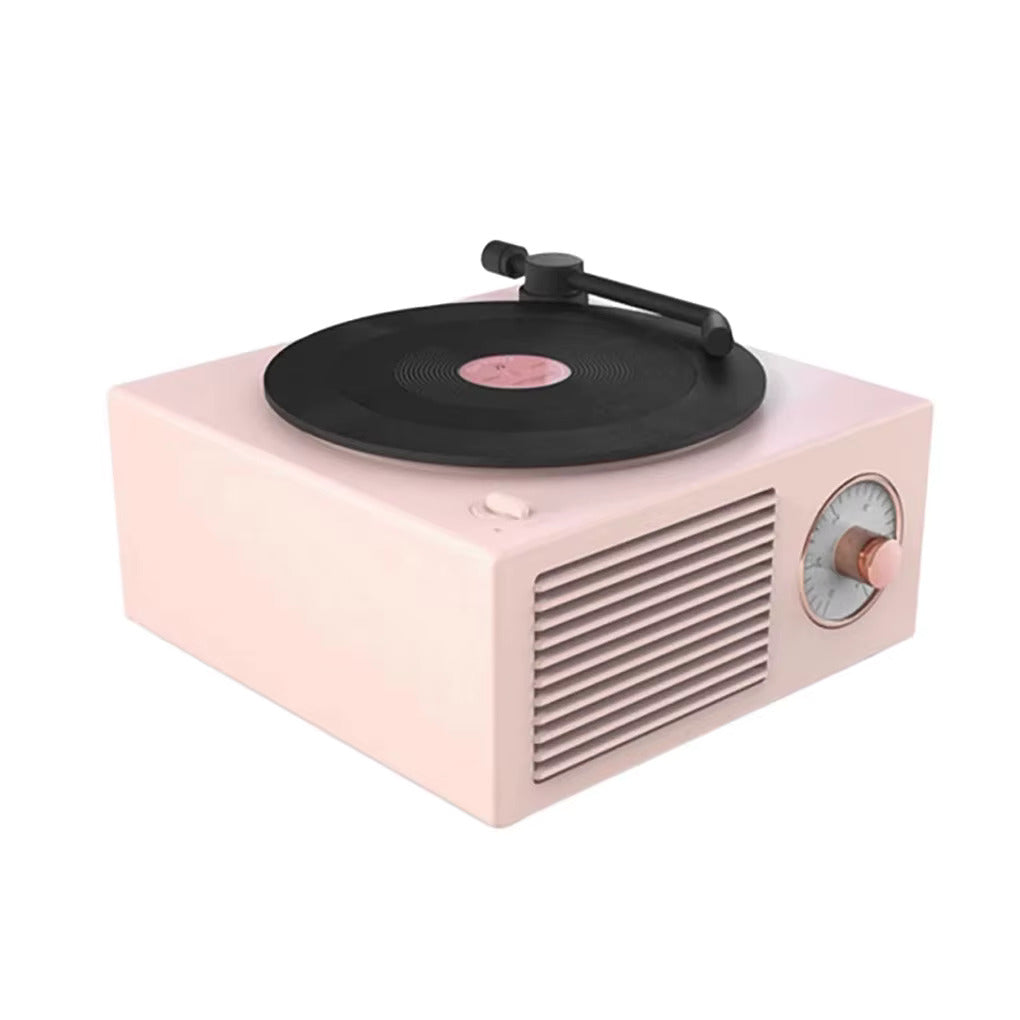 Rosa bluetooth-högtalare i form av en retro vinylspelare.