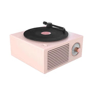Rosa bluetooth-högtalare i form av en retro vinylspelare.