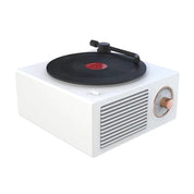 Vit bluetooth-högtalare i form av en retro vinylspelare.
